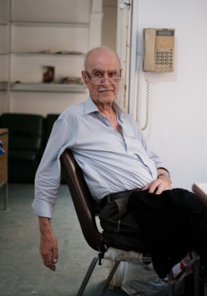 Portrait of a tailor who has devoted over 60 years to his trade within the walls of his modest studio.